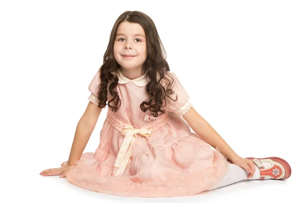 Menina de vestido sentado no chão — Fotografia de Stock