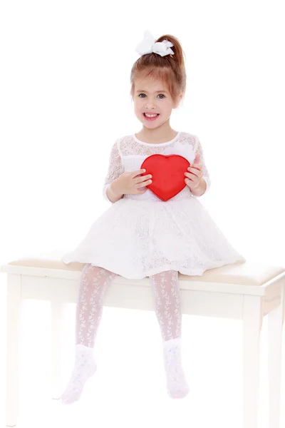 Cute little girl with a gift — Stock Photo, Image