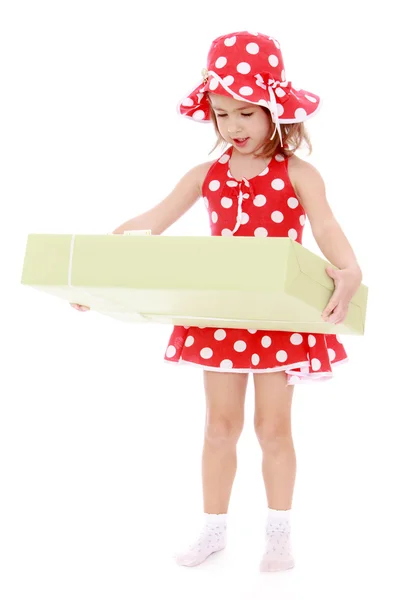 Cute little girl with a gift — Stock Photo, Image