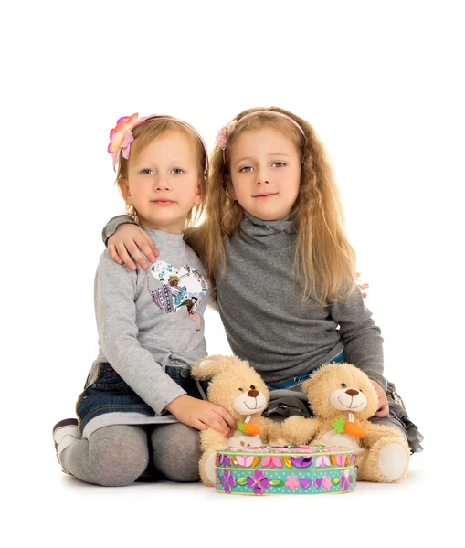 Sisters play on the floor — Stok fotoğraf