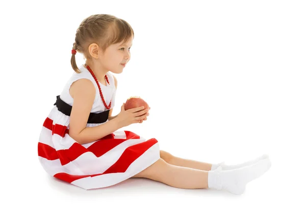 Girl with Apple in hands — Stock Photo, Image