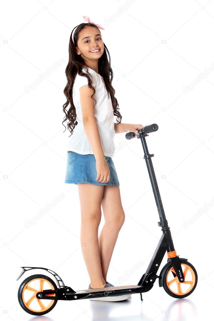 girl riding a scooter