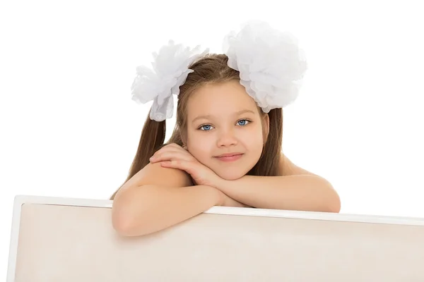 Beautiful girl with white bows — Stock fotografie