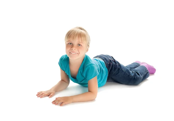 Little girl lying on the floor — Stock Photo, Image