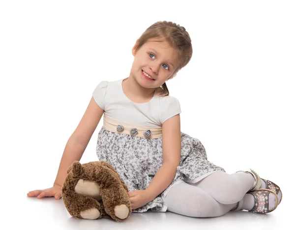 Little girl playing with soft toy — Stock Photo, Image