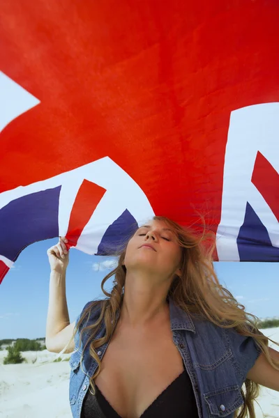 Girl under British national flag — Stock Photo, Image