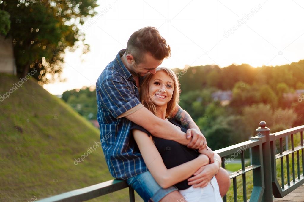 Man hugs a happy girl