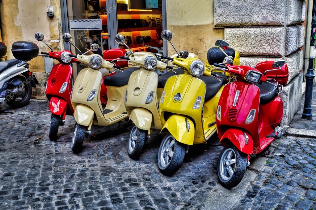 Scooters are parked on the city street in Rome, Italy — Stock Photo © samot 100491096