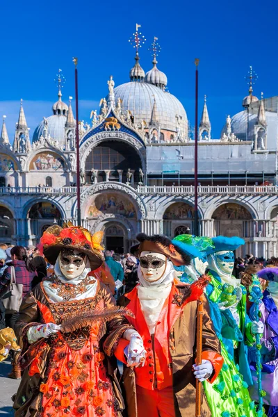 Venice with carnival masks against Mark's Square in Italy — Stock Photo, Image