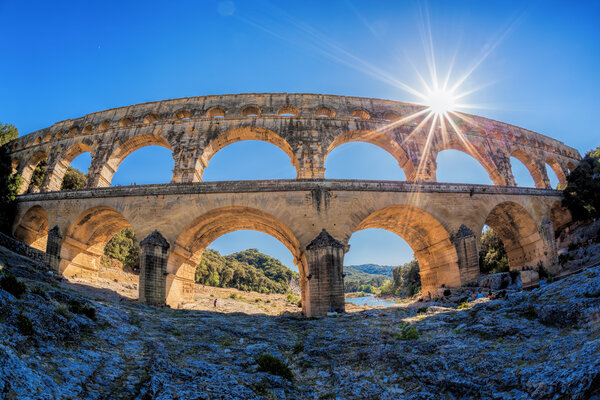 Pont du Gard against sunset is an old Roman aqueduct in Provence, France