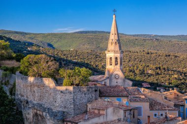 Saint-Saturnin-les-Apt with church bell in Provence, France clipart