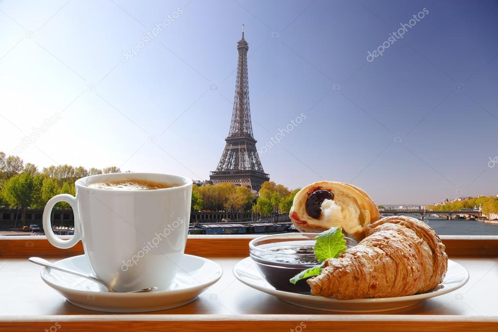 Coffee with croissants against Eiffel Tower in Paris, France