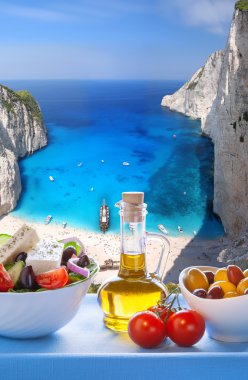  Navagio beach with Greek salad in Zakynthos, Greece clipart