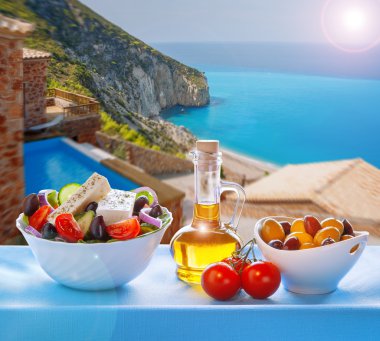 Lefkada island with Greek salad in Greece clipart