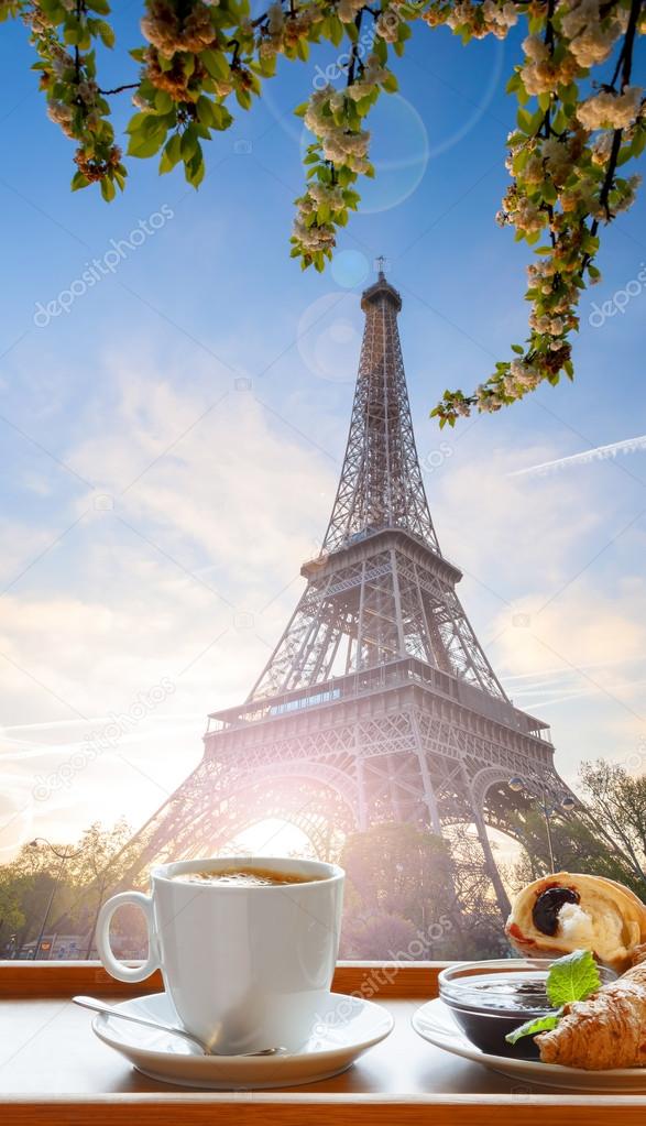 Coffee with croissants against Eiffel Tower in Paris, France