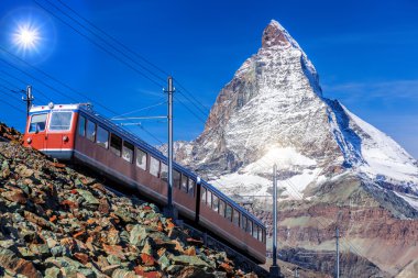 Matterhorn peak with a train in Swiss Alps, Switzerland clipart