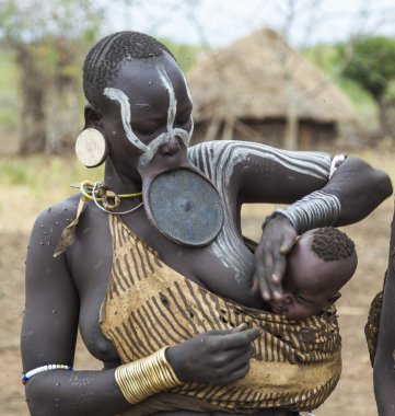 Woman from Mursi tribe in Mirobey village. Mago National Park. Omo Valley. Ethiopia. clipart