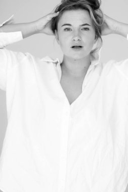 attractive fat woman in a white oversized shirt. Beautiful smiling woman
