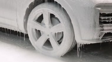 Car wash. Cleaning the car using high pressure water.