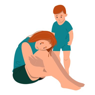 Üzgün anne yerde onunla oturuyor.