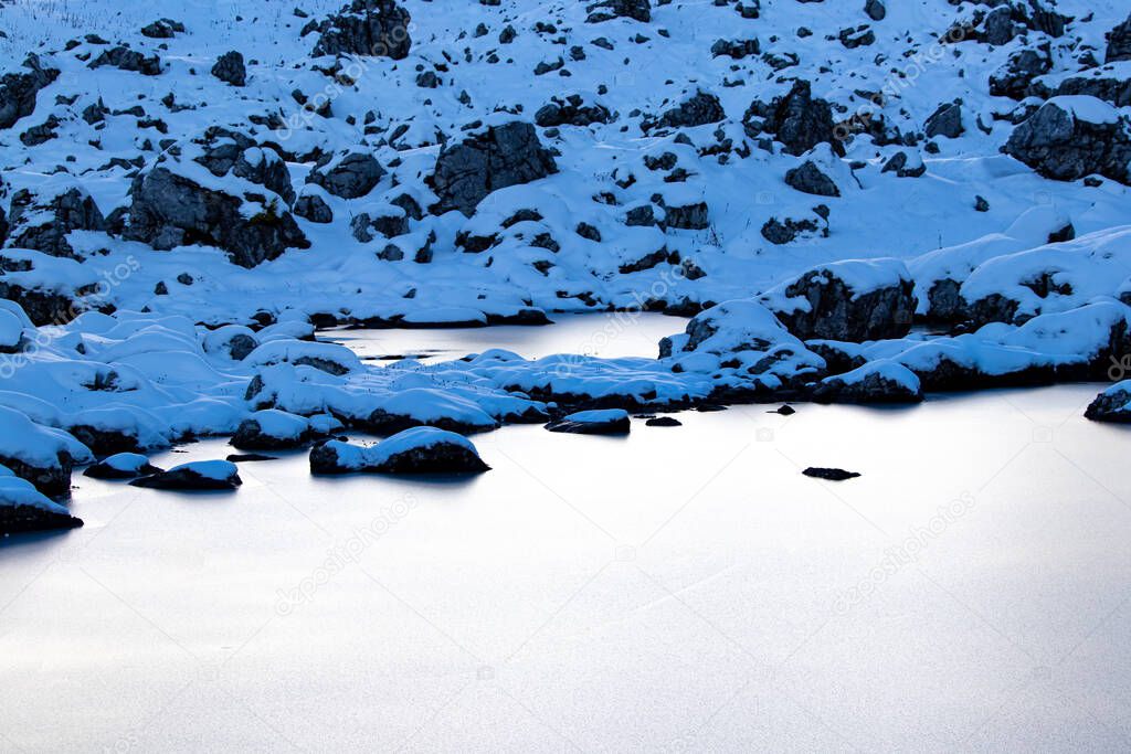 Frozen lake in high mountains, Julian alps