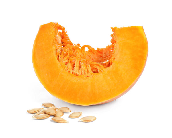 Piece of ripe orange pumpkin and seeds isolated on white