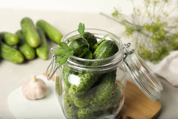 Pickling jar with fresh cucumbers on light table, closeup — Stock Image Pickling Jar Fresh Cucumbers Light Table Closeup Stock Image