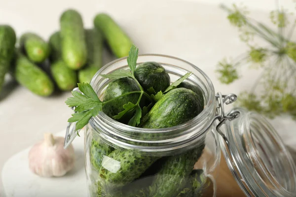 Pickling jar with fresh cucumbers on light table, closeup — Stock Image Pickling Jar Fresh Cucumbers Light Table Closeup Stock Photo