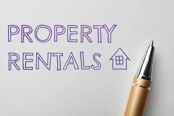 Text Property Rentals Pen White Paper Widok Góry — Zdjęcie stockowe