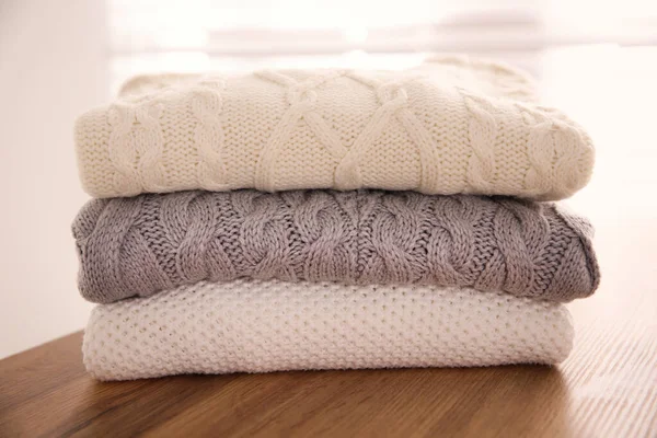 Stack Folded Warm Sweaters Wooden Table Indoors Closeup — Stock Photo, Image