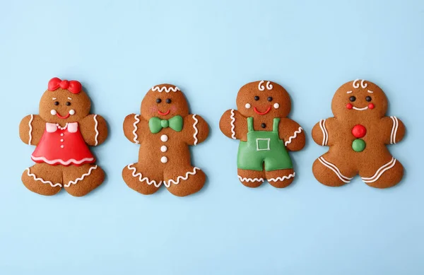 Christmas Human Shaped Gingerbread Cookies Light Blue Background Flat Lay — Stock Photo, Image
