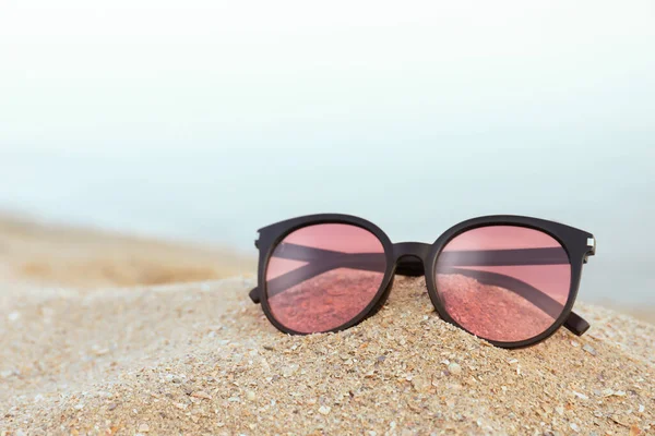 Stylish Sunglasses Sandy Beach Sea — Stock Photo, Image