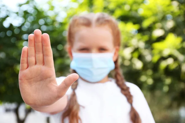 Little Girl Protective Mask Showing Stop Gesture Outdoors Focus Hand — Stock Photo, Image