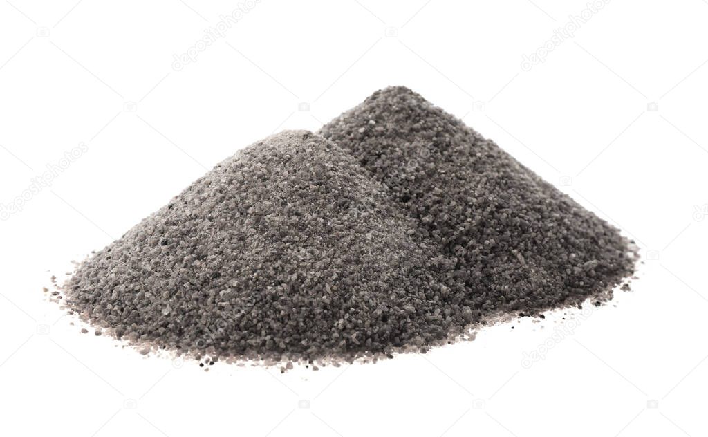 Piles of ground black salt isolated on white