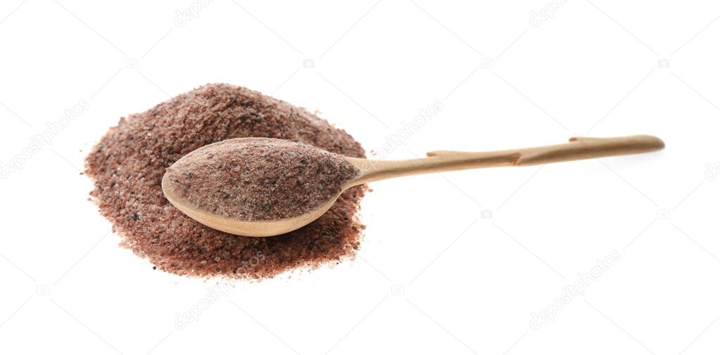 Pile of ground black salt with wooden spoon isolated on white