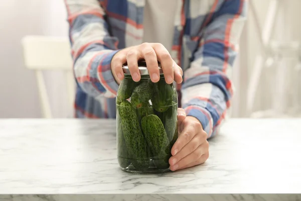 Woman pickling glass jar of cucumbers at white marble kitchen table, closeup — Stock Image Woman Pickling Glass Jar Cucumbers White Marble Kitchen Table Closeup Stock Picture