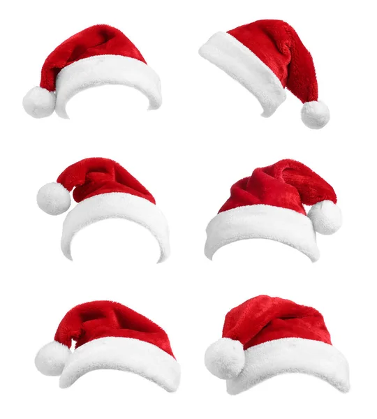 白色背景的一套红色圣诞帽 — 图库照片