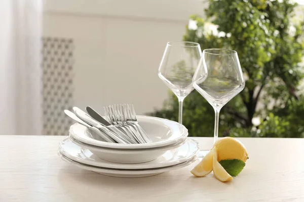 Set Clean Dinnerware Lemon Table Indoors — Stock Photo, Image