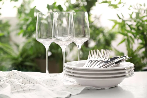 Set Clean Dishware Cutlery Wineglasses White Table Blurred Background — Stock Photo, Image