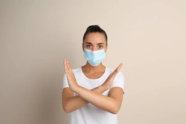 Woman Protective Mask Showing Stop Gesture Beige Background Prevent Spreading — Stock Photo, Image