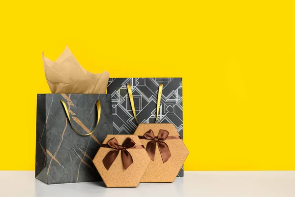 Shopping Bags Gift Boxes Yellow Background Space Text — Stock Photo, Image