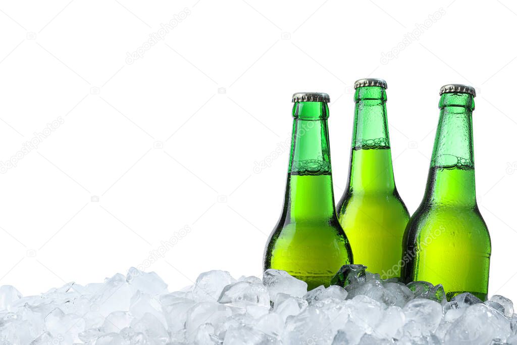 Bottles of beer on ice cubes against white background