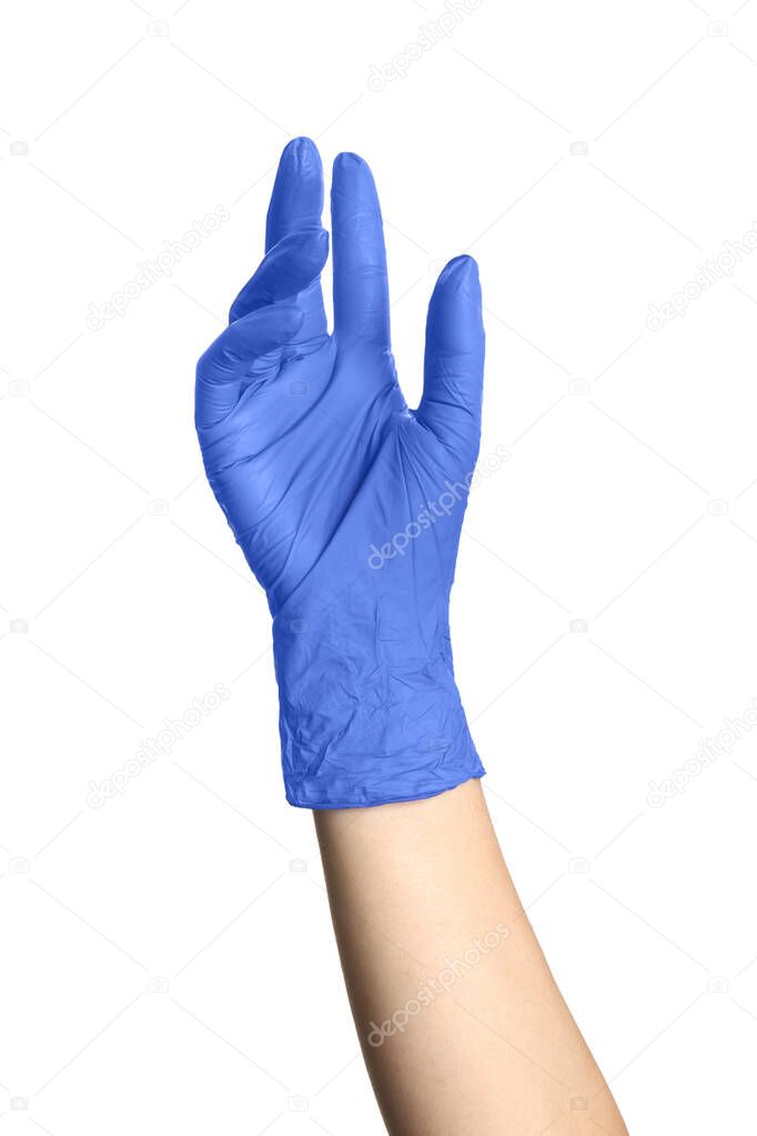 Woman in blue latex gloves holding something on white background, closeup of hand