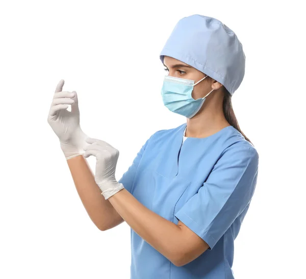 Doctor Protective Mask Scrubs Putting Medical Gloves White Background — Stock Photo, Image