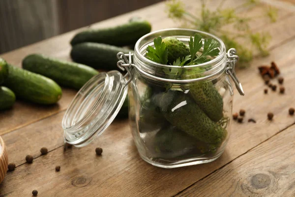 Pickling jar with fresh cucumbers on wooden kitchen table, closeup — Stock Image Pickling Jar Fresh Cucumbers Wooden Kitchen Table Closeup Royalty Free Stock Images