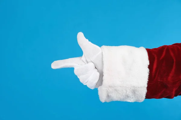 Weihnachtsmann Zeigt Auf Etwas Auf Blauem Hintergrund Nahaufnahme Der Hand — Stockfoto