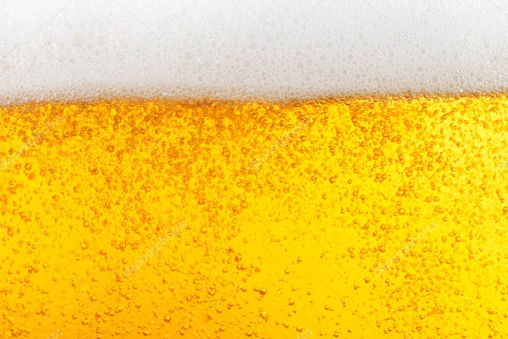 Glass of tasty beer with foam, closeup