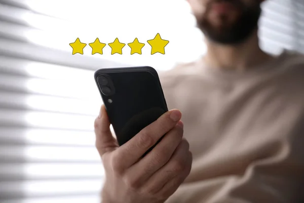 Man Leaving Review Online Smartphone Indoors Closeup Five Stars Gadget — Stock Photo, Image