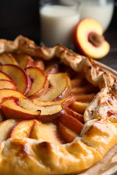 Delicious fresh peach pie on table, closeup