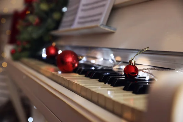 Red Baubles Fairy Lights Piano Keys Indoors Space Text Christmas — Stock Photo, Image